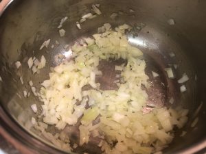 chopped onion in pot
