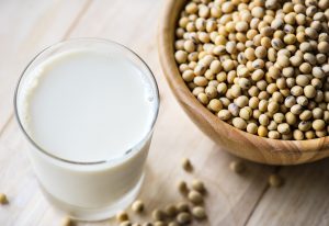 glass of milk and bowl of legumes