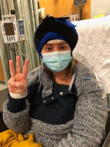 Woman wearing cold cap prior to chemotherapy.