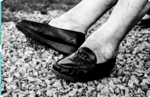 black and white photo of older woman's legs