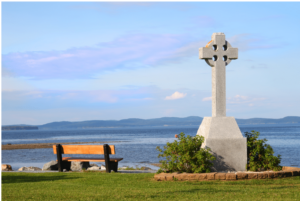 Celtic sea, land, bench and Celtic cross