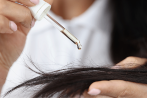 applying castor oil to hair